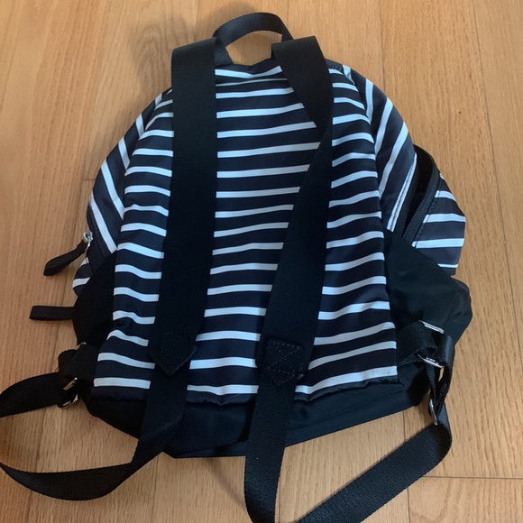 This is a black and white stripped mini backpack from Ivivva. - Picture 5 of 5